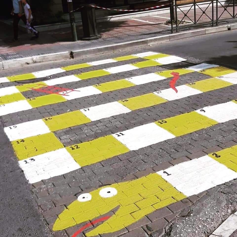 LAComicsFestival in Larissa - snakes and ladder game on the crossing path