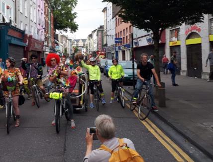 People riding the bike in Cork