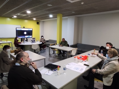 People sitting at a table during the IAP meeting